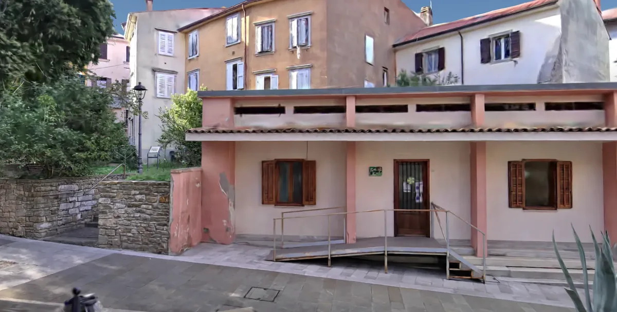 Still from the post: the harbour town of Muggia, as the game draws it